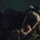 Venom 2's symbiote comes at the camera with many, many pointy bared teeth.